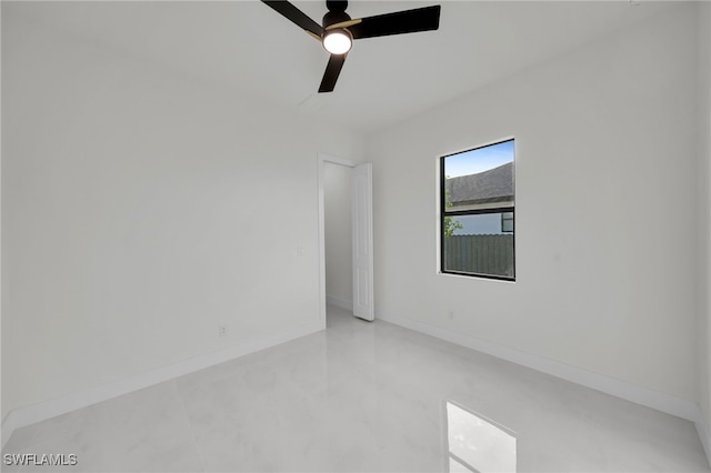 2125 Trafalgar Pkwy, Cape Coral, FL 33991 - spare room featuring ceiling fan and baseboards