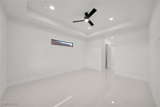 2125 Trafalgar Pkwy, Cape Coral, FL 33991 - unfurnished room featuring a raised ceiling, recessed lighting, ceiling fan, and baseboards