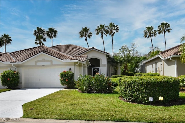 view of front of home with a garage and a front lawn