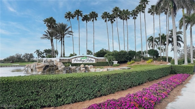 community / neighborhood sign featuring a water view