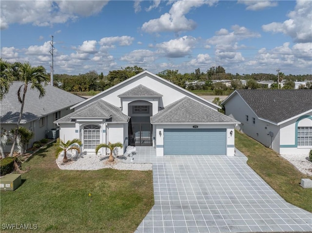 3758 Sabal Springs Blvd, North Fort Myers, FL 33917 - view of front of home with a front yard and a garage