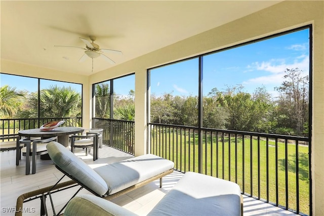 sunroom / solarium with ceiling fan