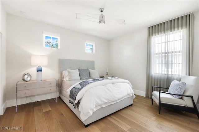 bedroom with hardwood / wood-style flooring