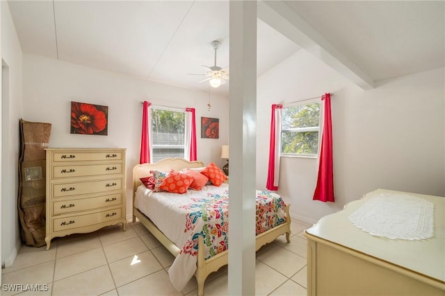 tiled bedroom featuring lofted ceiling with beams and ceiling fan