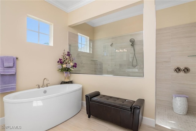 bathroom with independent shower and bath and ornamental molding