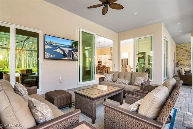 view of patio with an outdoor hangout area and ceiling fan