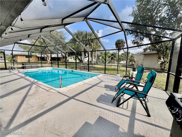 view of pool with a lanai and a patio area