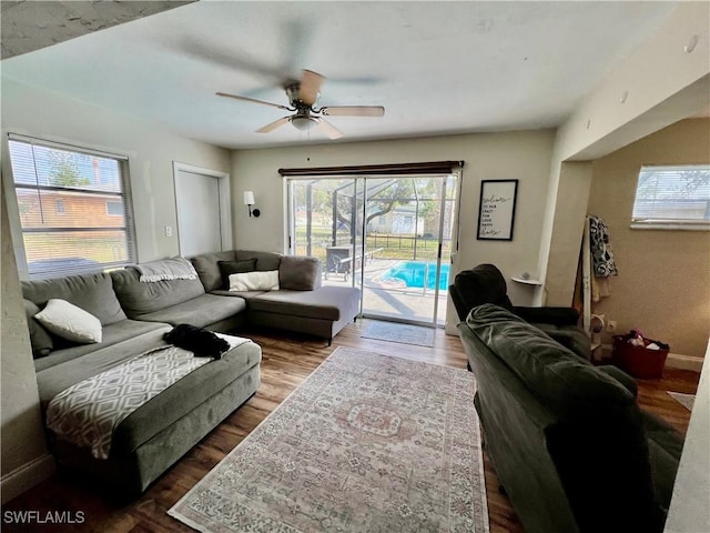 living room with hardwood / wood-style floors and ceiling fan