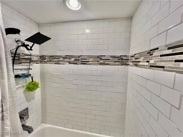 bathroom with shower / bath combination with curtain