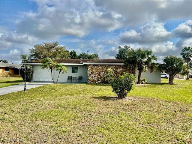 ranch-style house with a garage and a front lawn