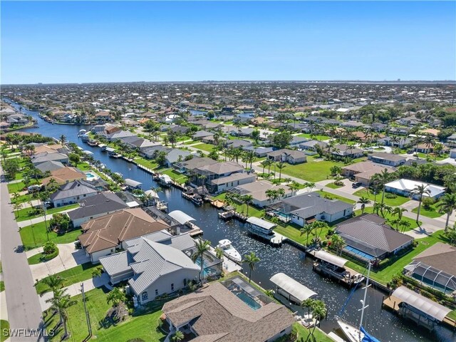 bird's eye view with a residential view and a water view