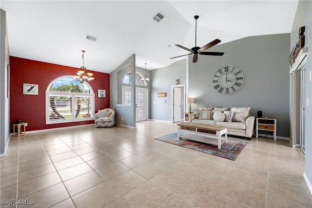 living room with ceiling fan with notable chandelier, high vaulted ceiling, and light tile patterned floors