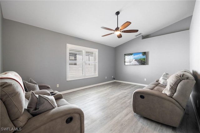 living room with lofted ceiling, wood-type flooring, and ceiling fan