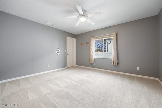 unfurnished room featuring light colored carpet and ceiling fan