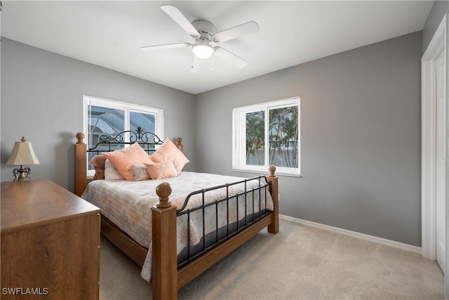 bedroom with ceiling fan and carpet floors