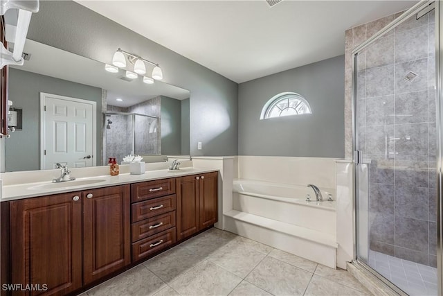 bathroom with vanity, tile patterned floors, and plus walk in shower