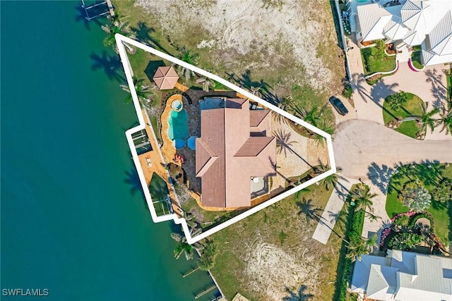 birds eye view of property with a water view