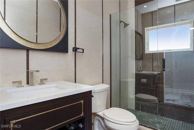 342 Germain Ave, Naples, FL 34108 - bathroom featuring toilet, a stall shower, and tile walls