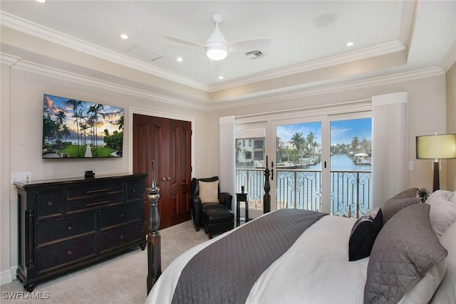 342 Germain Ave, Naples, FL 34108 - bedroom with visible vents, a water view, a tray ceiling, and access to outside