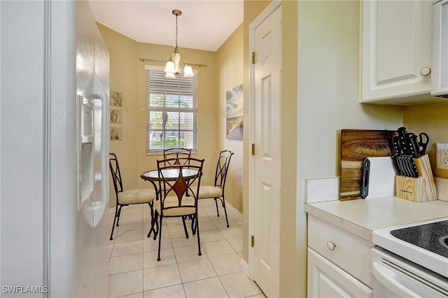 tiled dining area with a chandelier