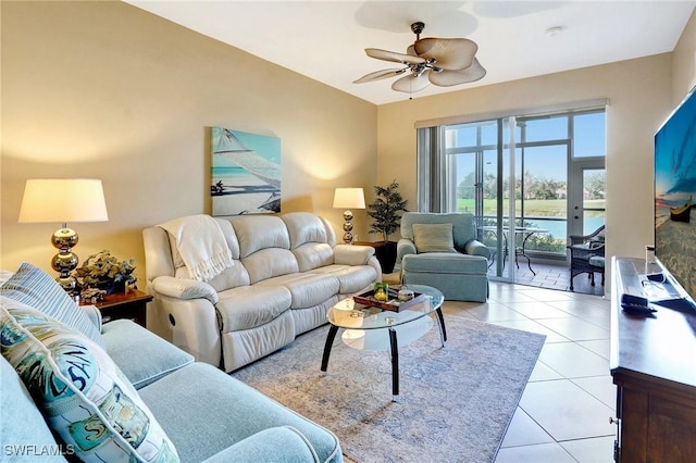 living room with light tile patterned floors and ceiling fan