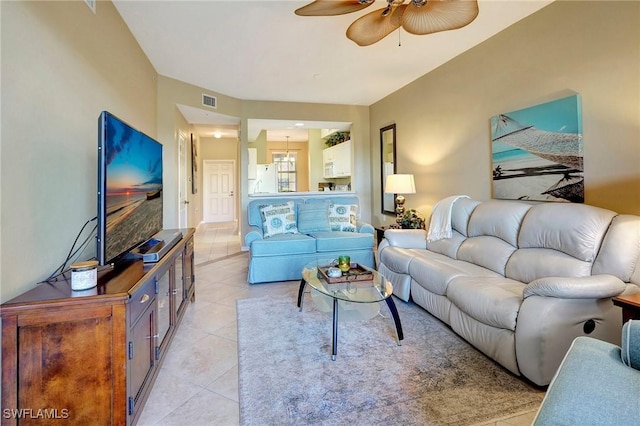 living room with light tile patterned floors and ceiling fan