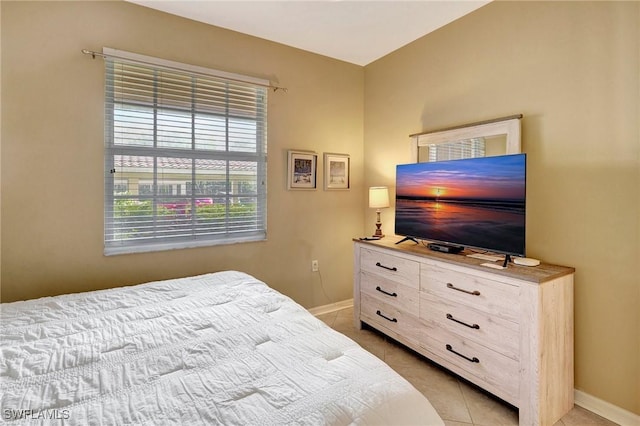 bedroom with light tile patterned flooring