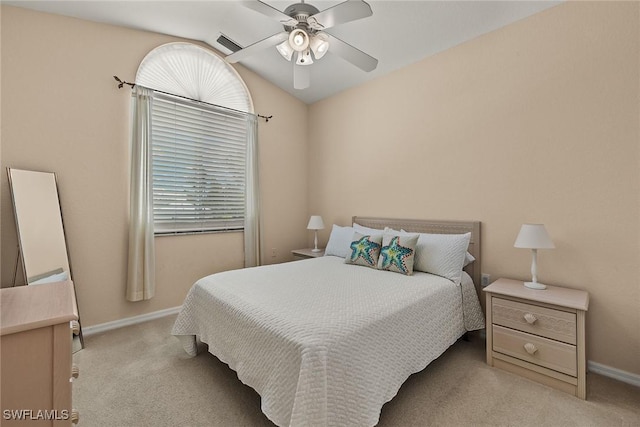 bedroom with lofted ceiling, light colored carpet, ceiling fan, and visible vents