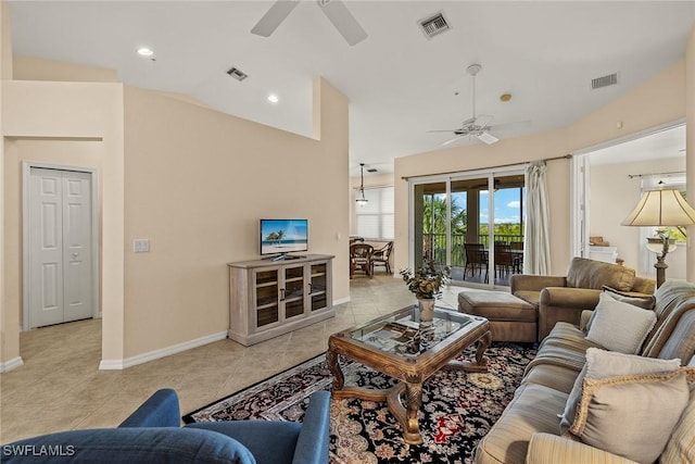 tiled living room with lofted ceiling and ceiling fan