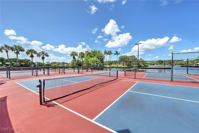 view of sport court with fence