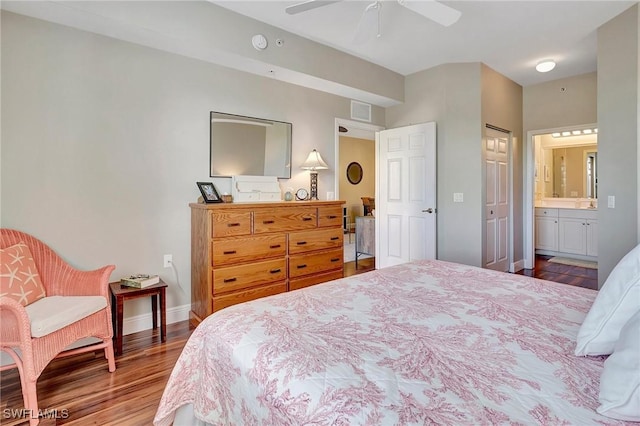 bedroom with visible vents, ceiling fan, connected bathroom, wood finished floors, and baseboards