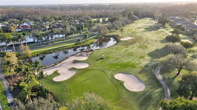 bird's eye view featuring view of golf course and a water view