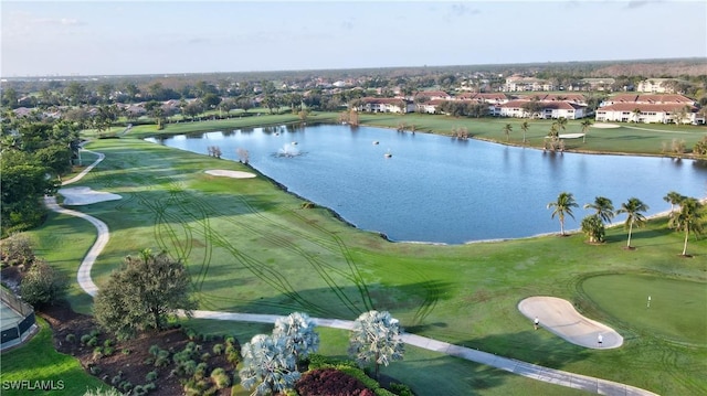 bird's eye view featuring a water view and golf course view