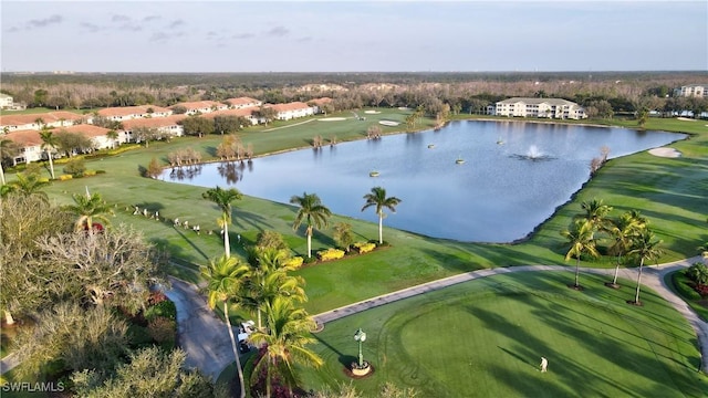 birds eye view of property featuring view of golf course and a water view