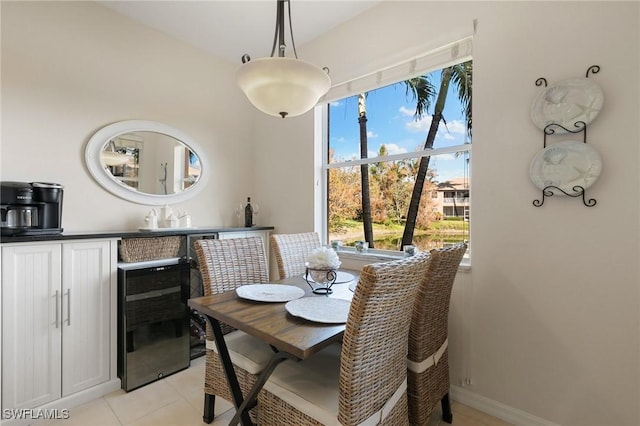 dining area with light tile patterned floors and wine cooler