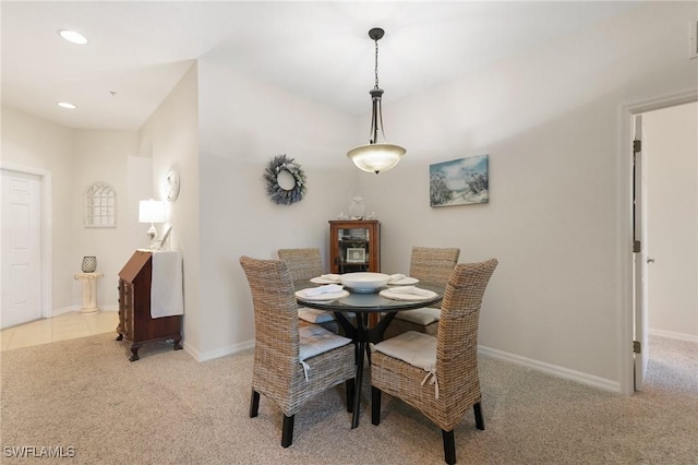 dining room with light colored carpet