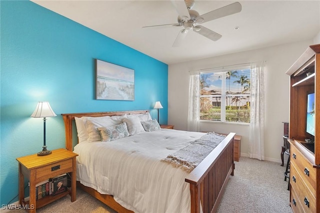 bedroom featuring light colored carpet and ceiling fan