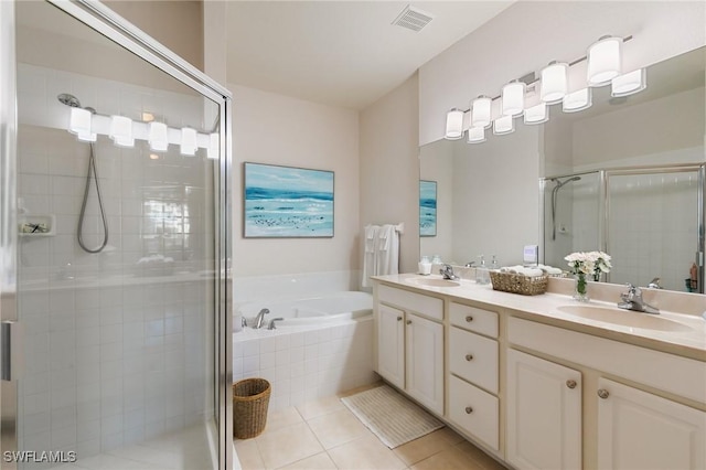 bathroom with tile patterned floors, plus walk in shower, and vanity