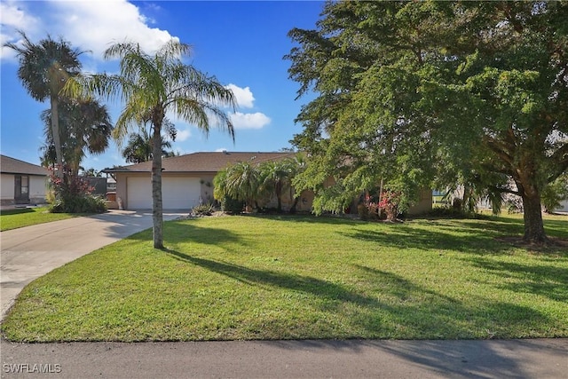 view of front of home with a garage and a front yard