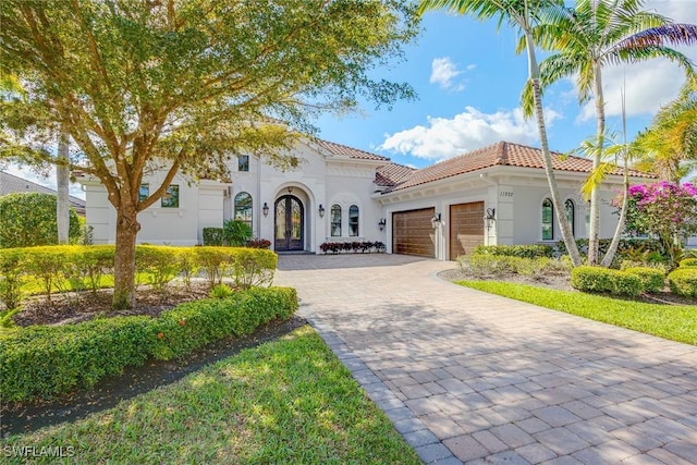 mediterranean / spanish-style house featuring a garage