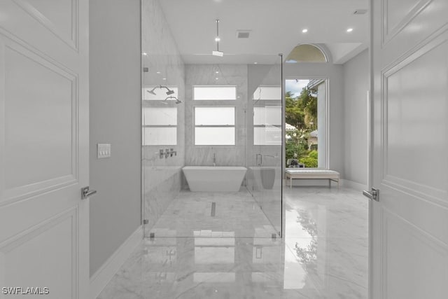 bathroom with shower with separate bathtub