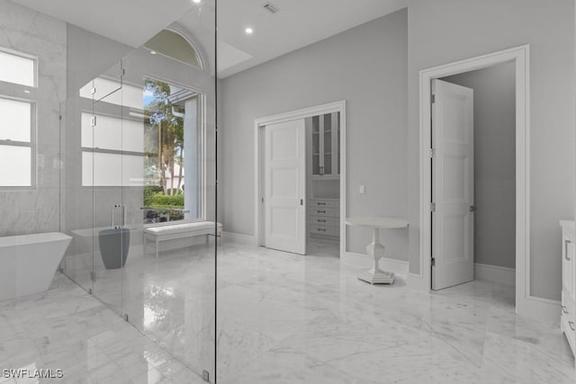 bathroom with vanity, separate shower and tub, and a wealth of natural light