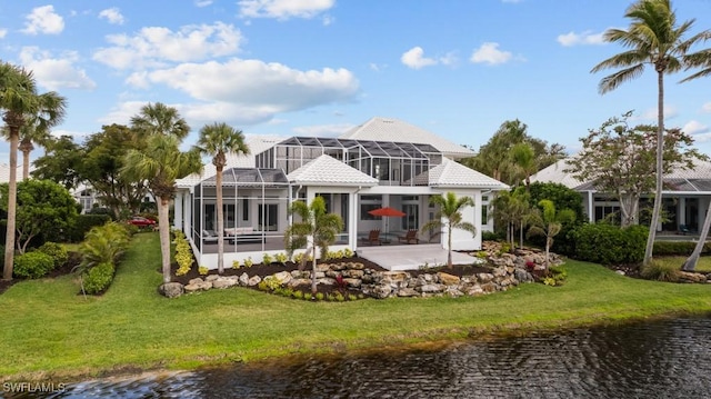 4306 Sanctuary Way, Bonita Springs, FL 34134 - rear view of property featuring a patio, a yard, a water view, and a lanai