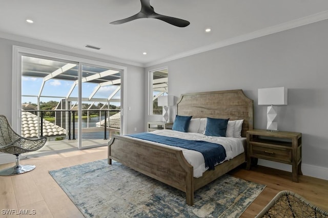 bedroom featuring access to exterior, crown molding, wood-type flooring, and ceiling fan