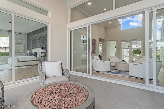 sunroom / solarium with ceiling fan