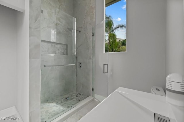 4306 Sanctuary Way, Bonita Springs, FL 34134 - bathroom with a healthy amount of sunlight, a marble finish shower, and toilet