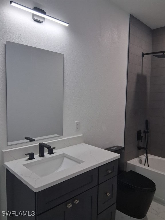 full bathroom featuring vanity, toilet, and tiled shower / bath combo