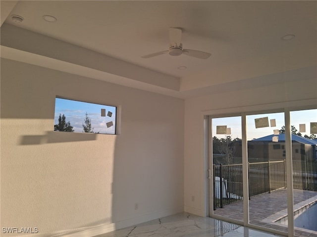 interior space featuring ceiling fan