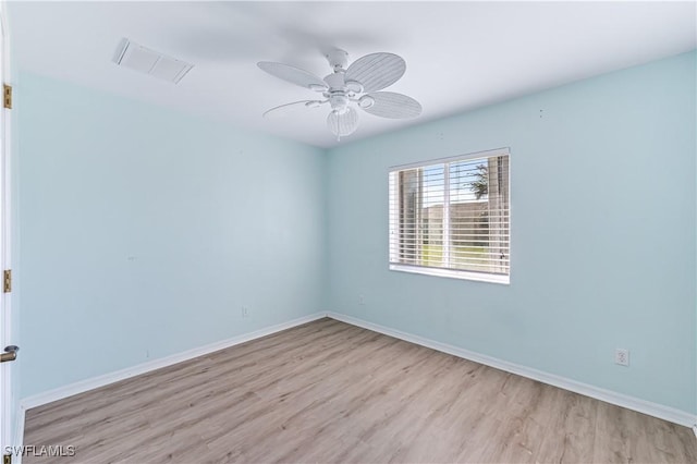 spare room featuring ceiling fan and light hardwood / wood-style flooring