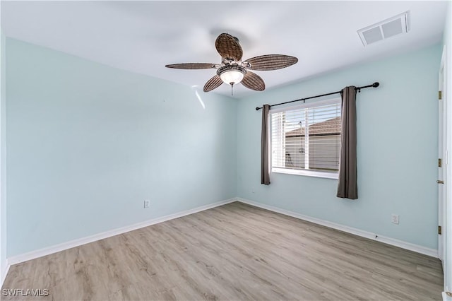 spare room with ceiling fan and light hardwood / wood-style floors